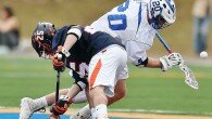 Hamilton's Eric Zermuehle (20) looks to control the ball off a second half faceoff against Utica College's Mitch Sobilo (25) (Photo By - Jeff Pexton - Perfect Game Imaging)