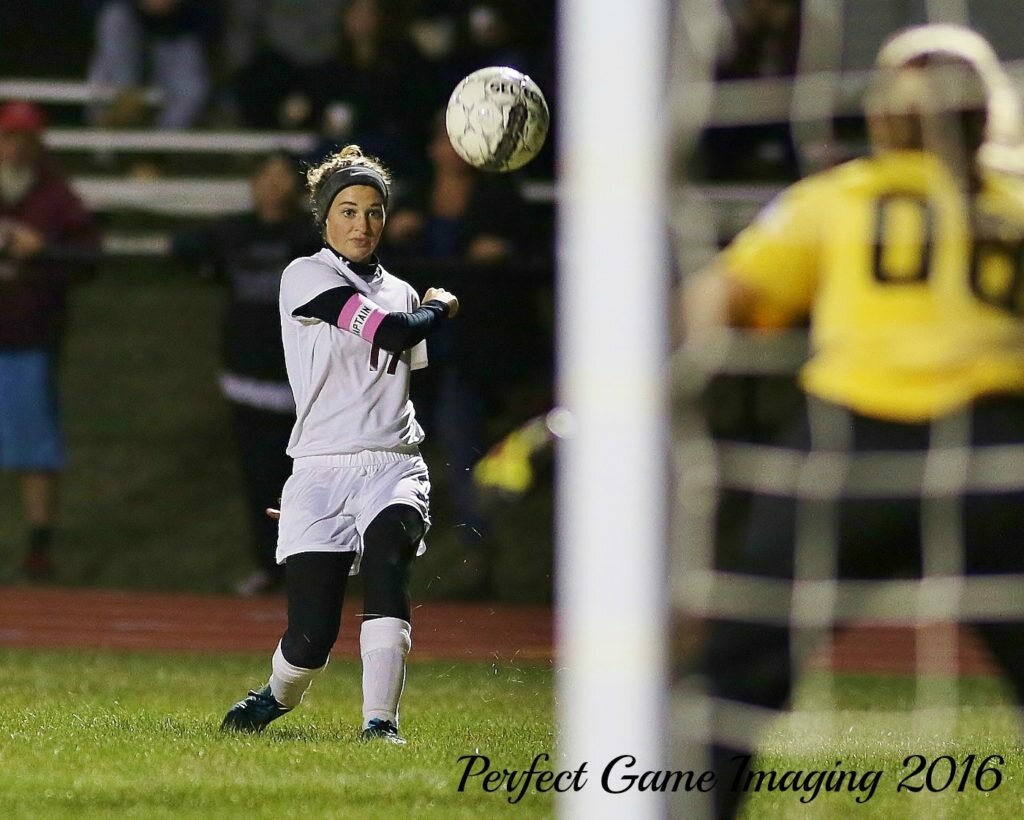 Rose Simmons (17) hammers a second half shot as Notre Dame Keeper Abbey Hawes (00) stands her ground. (Photo By - Jeff Pexton - Perfect Game Imaging).