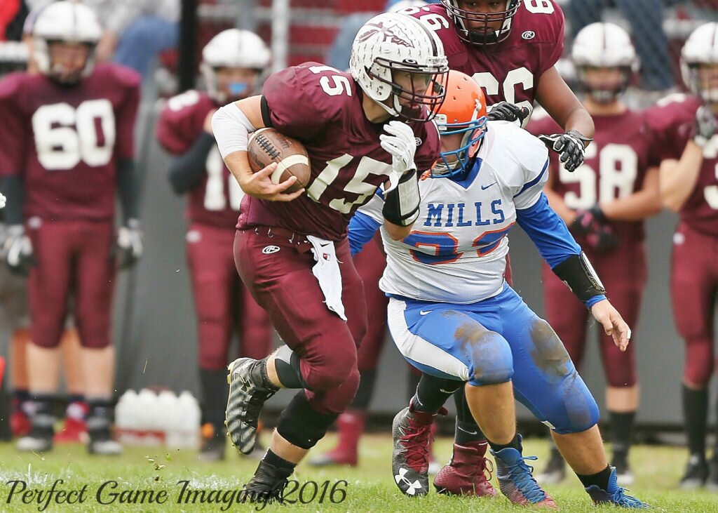 Oriskany quarterback Ryan Enos (15) scampers for a 4th quarter score. The senior hand a hand in all 7 of his team's touchdowns. (Photo By - Jeff Pexton - Perfect Game Imaging).